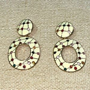 Sassy Jones gold earrings.
